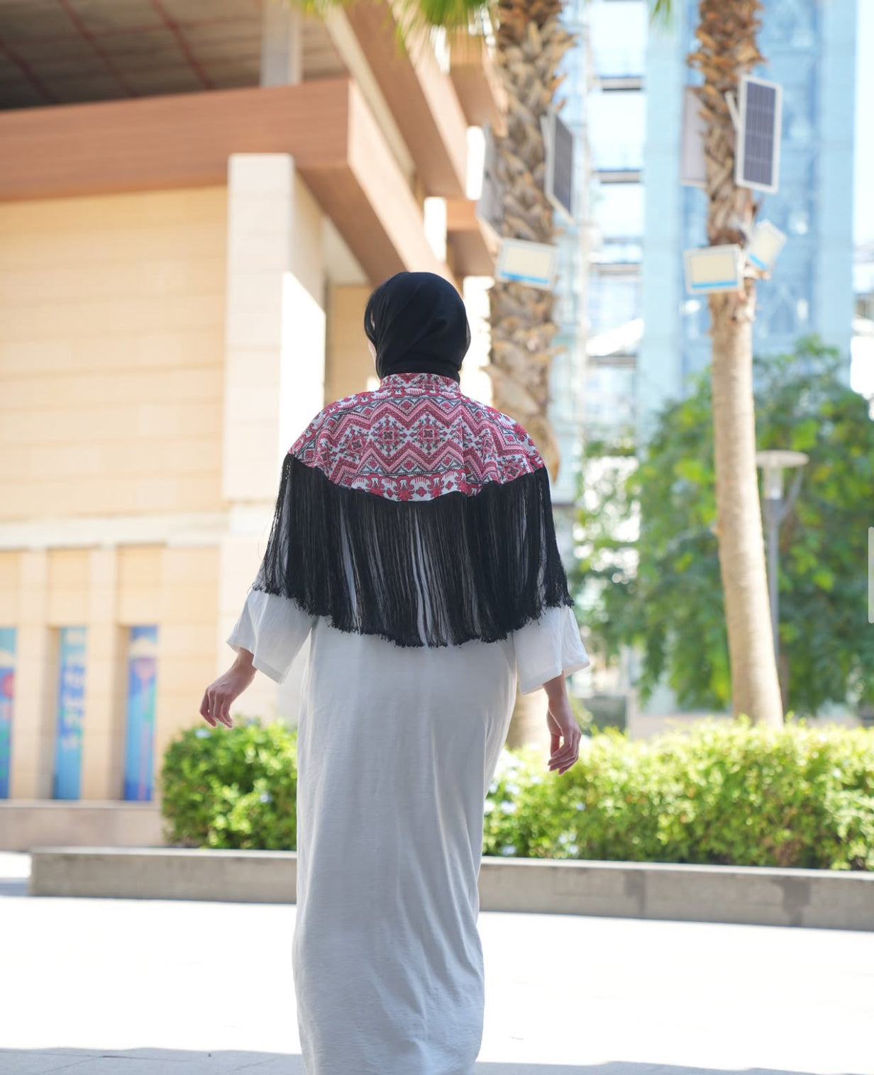 Embroidered White Abaya with Black Tassel Elegance