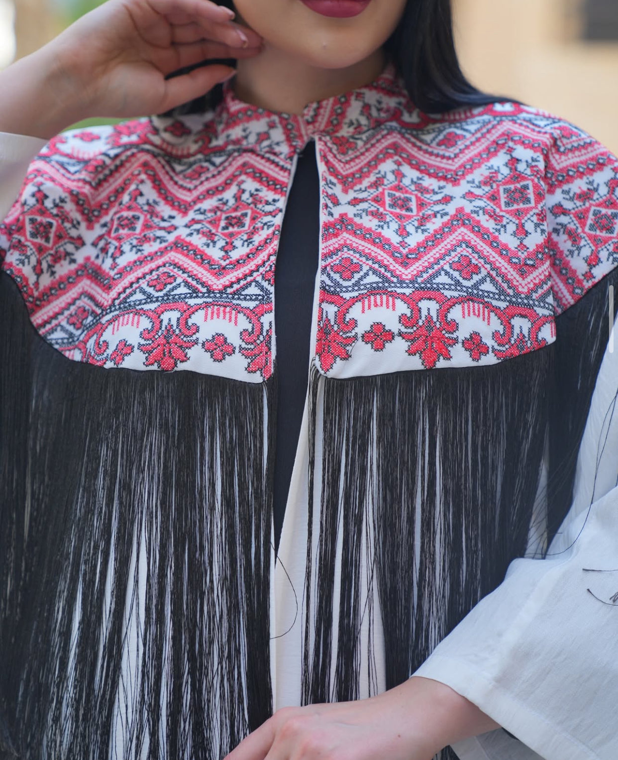 Embroidered White Abaya with Black Tassel Elegance